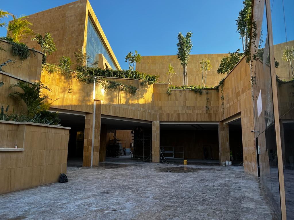 Via Riyadh stone facade with rooftop greenery